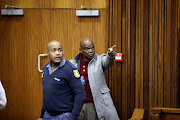 Former crime intelligence boss Richard Mdluli remonstrates with a photographer during his trial at the Johannesburg high court on Tuesday July 30 2019.