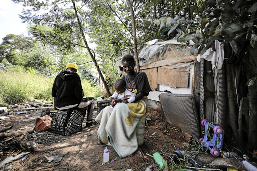 Florence Chauke and her baby at home near Edenvale Hospital, east of Johannesburg. The area has been occupied by Alexandra residents