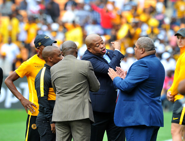 Bobby Motaung agitated in what looks to be a heated discussion between him and a match officia as the Kaizer Chiefs coaching and communications staff tries to calm him down during a Soweto derby match against arch rivals Orlando Pirates at FNB Stadium on February 29 2020.