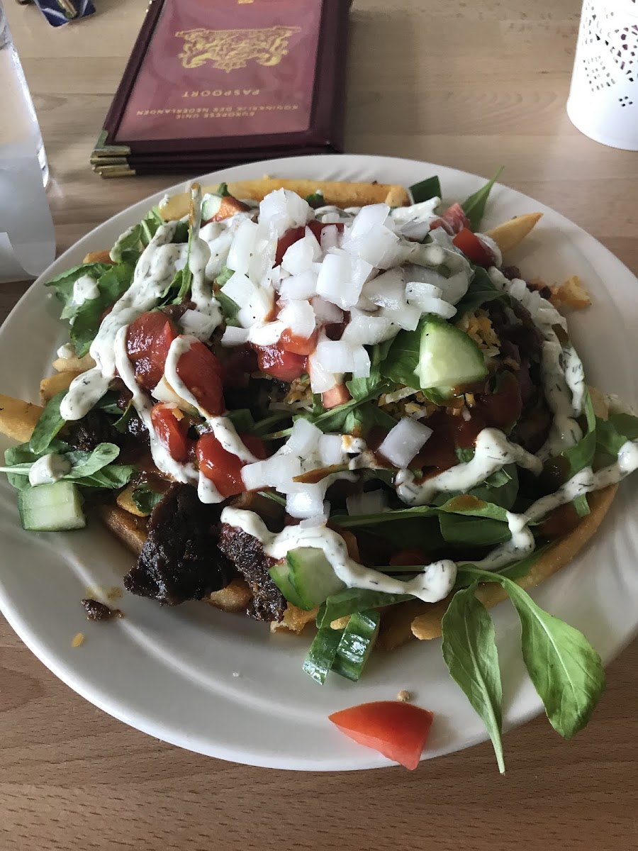 100% gluten free!  French fries with shawarma, cucumber, arugula, onions, cheese....very large portion. Shareable.