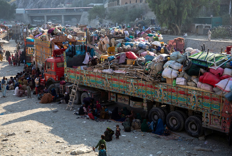 Trucks loaded with goods are seen as Afghan nationals head back to Afghanistan, at the Torkham border crossing between Pakistan and Afghanistan, on October 30 2023. Picture: THE NORWEGIAN REFUGEE COUNCIL HANDOUT VIA REUTERS