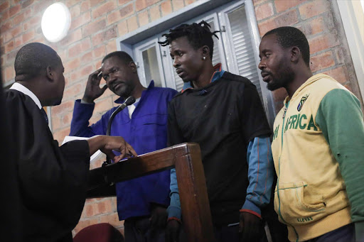 From Left: Walter Mhangani, Emmanuel Mdhuli and Xongani Mathebula appear in the Skukuza Regoinal Court in the Kruger National Park. The three were arrested after poaching three Rhino in the park on Sunday. Picture: Alaister Russell/The Times