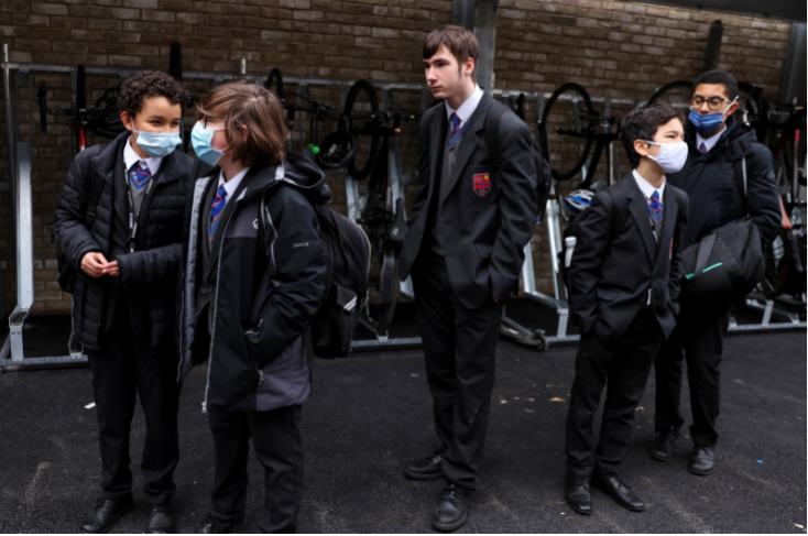 Students arrive for the first day back at school, as the coronavirus disease lockdown begins to ease, at Fulham Boys School in London, Britain, on March 8 2021.