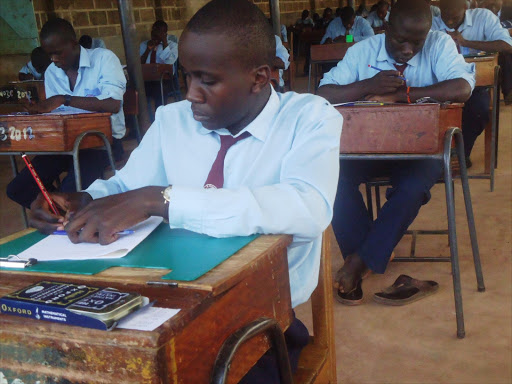 Form four candidates of St Peter's High school, Mumias, write a paper in the Kenya Certificate of Secondary Education exam, October 23, 2013. Photo/SHABAN MAKOKHA