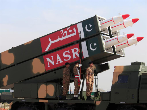 Pakistani military personnel stand beside short-range Surface to Surface Missile NASR during Pakistan Day military parade in Islamabad, Pakistan, March 23, 2017. /REUTERS