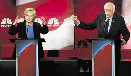 DUELLING DUO: Democratic US presidential candidate and former Secretary of State Hillary Clinton, left, and rival candidate US Senator Bernie Sanders speak simultaneously at the NBC News-YouTube Democratic presidential candidates debate in Charleston, South Carolina on Sunday