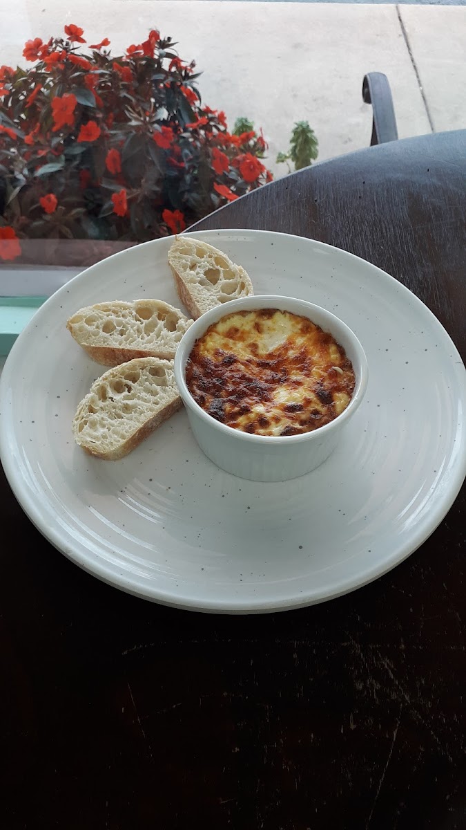 Shirred eggs with gluten free bread to dip in.