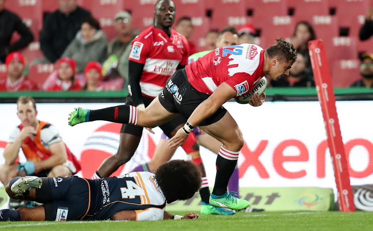 Rohan Janse van Rensburg scores a try while challenged by Rory Arnold of the Brumbies during the Super Rugby match at Ellis Park Stadium, Johannesburg on May 19 2018.