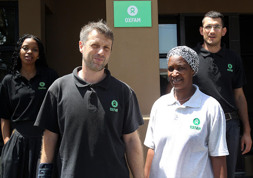 Oxfam Italia country director Riccardi Roccardo at the bottom left with his colleagues Nomzimasi Sidiki,Nomaxhosa Ndalisi and Samuel Silve at the company office in Vincent where they were preparing for the move..Picture: SIBONGILE NGALWA