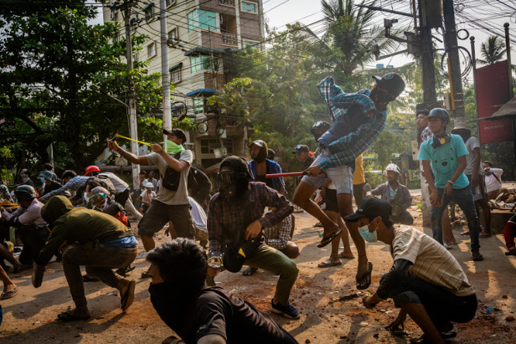 One of the more forceful episodes in the boo ‘The Revolution Will Not Be Litigated’ is about how legal activists have taken the fight to big American oil companies that have callously colluded with Myanmar’s military regime. Picture: GETTY IMAGES/STRINGER