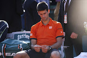 Serbia's Novak Djokovic reacts after his match against Switzerland's Stanislas Wawrinka at the end of their men's final match of the Roland Garros 2015 French Tennis Open in Paris on June 7, 2015.