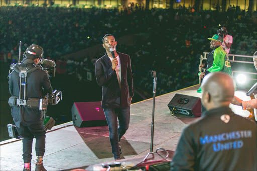 Zakes Bantwini entertains the crowd before the game