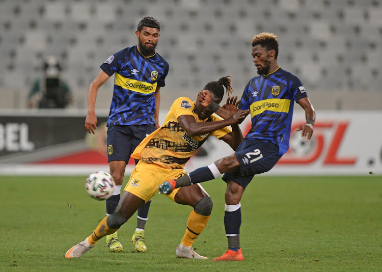 Mohamed Anas of Black Leopads is tackled by Thato Mokeke of Cape Town City during the DStv Premiership 2020/21 game between Cape Town City and Black Leopards at Cape Town Stadium.