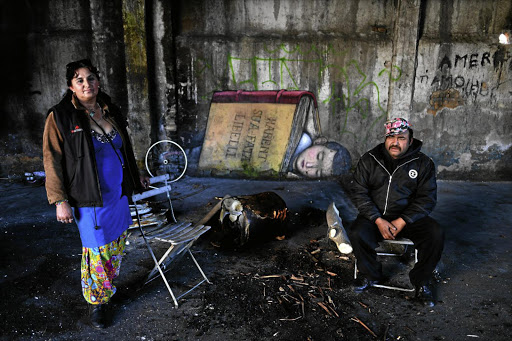 Resident Roma people Tito and Lena in the former Mira Lanza factory that is hosting installations and paintings by French artist Julien Malland as part of the exhibition ‘Range ta chambre’, which means ‘clean up your room’.