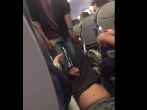A video showing a passenger being violently dragged out of an airplane has provoked outrage on social media.