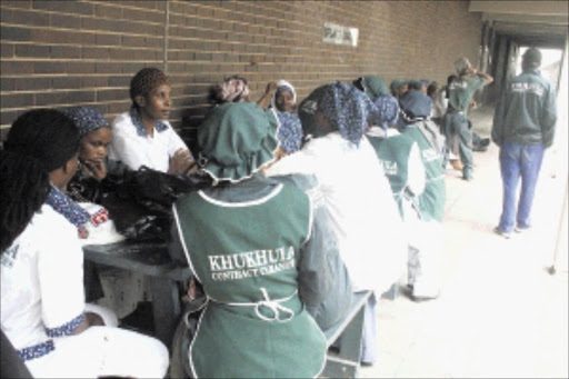 SHOCKED: Employees of Khukhula Cleaning Service ponder their future after the University of KwaZulu-Natal management terminated their contract. Pic: Thuli Dlamini. 02/03/2010. © Sowetan.
