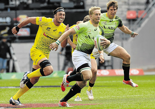 YOU WON'T STOP ME! Kyle Brown of South Africa runs in to score against Australia during the second day of the Nelson Mandela Bay Sevens Series in Port Elizabeth yesterday