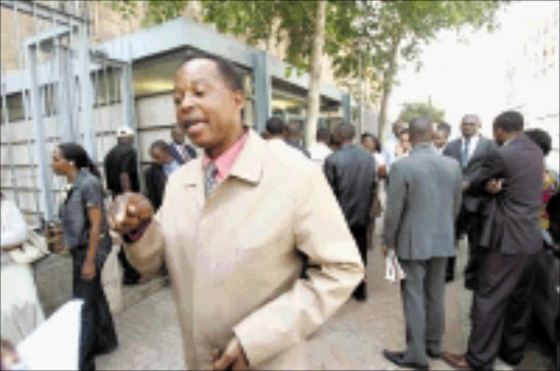 DISGRUNTLED: Claude Ntoko, a court interpreter, explains the reason he and his colleagues are on strike. Pic. Veli Nhlapo. 01/10/09/08. © Sowetan.