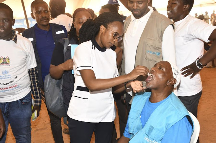 A nurse administers the Oral Cholera Vaccine during the rollout of the drive in Tana River county on February 11, 2023