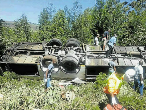 HORRIFIC SCENE: Rescue workers help extricate wounded passengers and bodies after a bus accident between Ngcobo and Elliot, in which 13 people died Picture: FACEBOOK