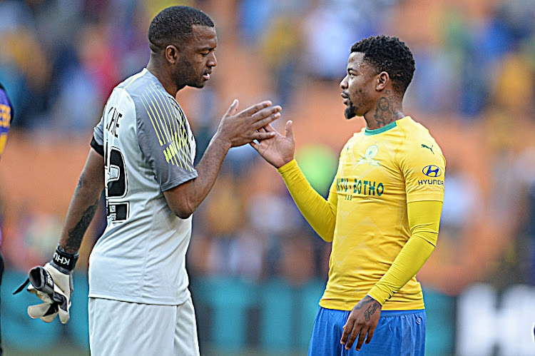 Kaizer Chiefs goalkeeper Itumeleng Khune and George Lebese of Sundowns during the Shell Helix Ultra Cup match between Kaizer Chiefs and Mamelodi Sundowns at FNB Stadium on July 21, 2018 in Johannesburg, South Africa.