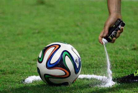 A generic picture of a referee using the vanishing spray during a football match.