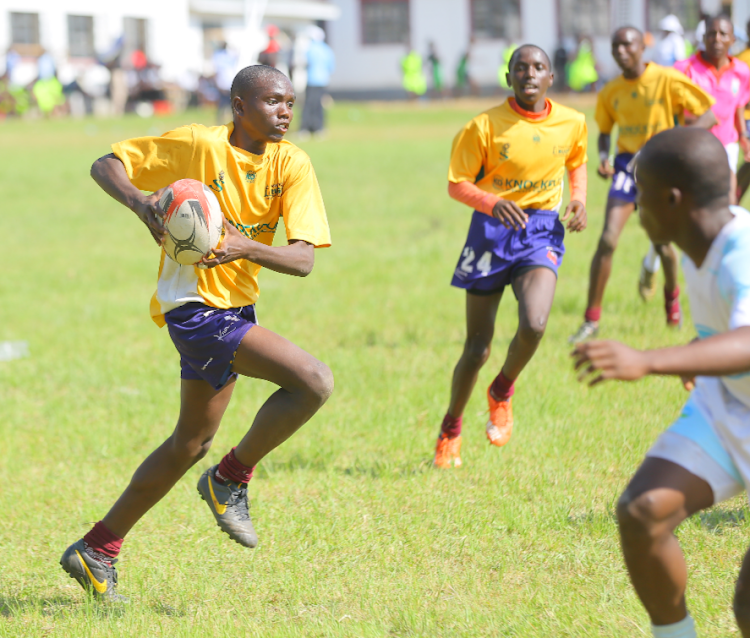 Purine Kaka of Nduru Boys in action against Agoro Sare in the semis