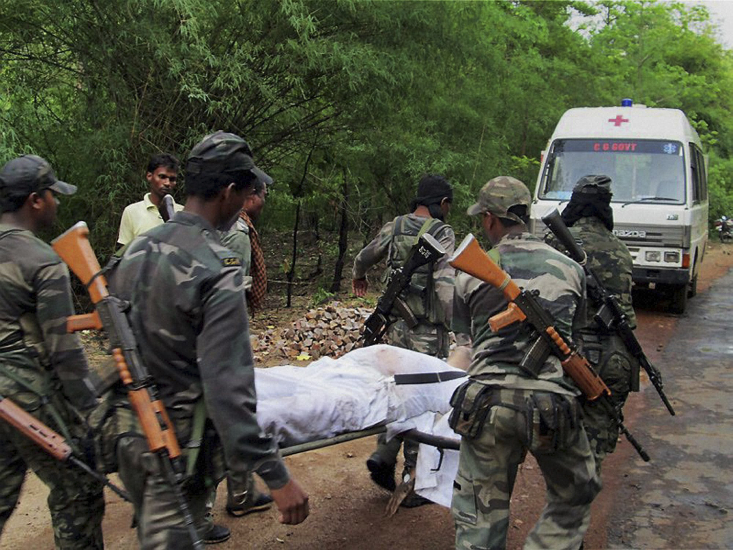 Why are BJP and Congress at odds over the investigation into the 2013 Maoist attack? 