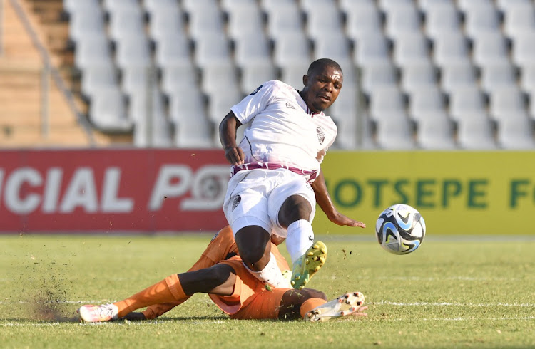 Sbusiso Tshabalala of Polokwane City tackles Mthokozisi Shwabule of Moroka Swallows on Saturday.