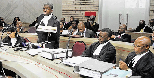 MAKING A POINT: Advocate Vincent Maleka SC, standing, representing the Nelson Rholihlahla Mandela Family Trust executors, addresses the Mthatha High Court yesterday Picture: LULAMILE FENI