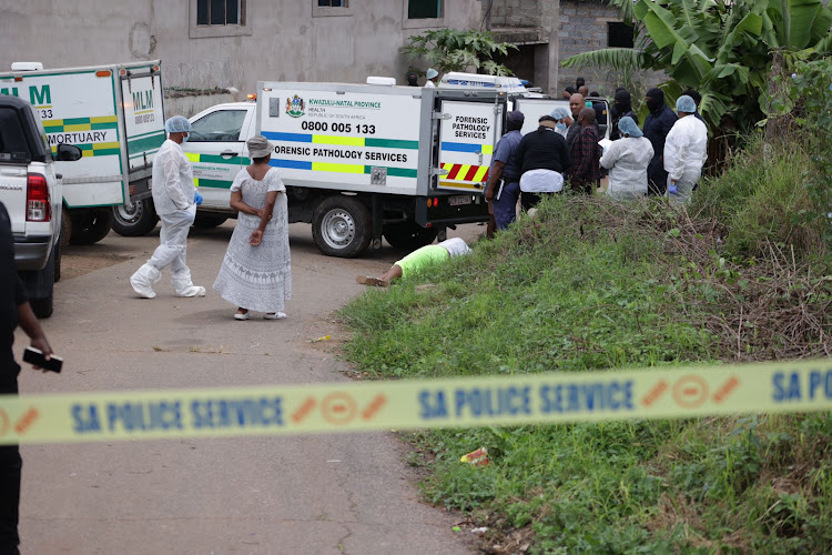 Emotions run high as community members identify the bodies of nine suspected criminals killed in a shoot-out with police in Mariannhill, Durban.