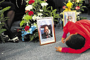 Two-year-old Lukuthi Mdlalo at the memorial service for his father, Sergeant Bafundi Mdlalo, in Cape Town