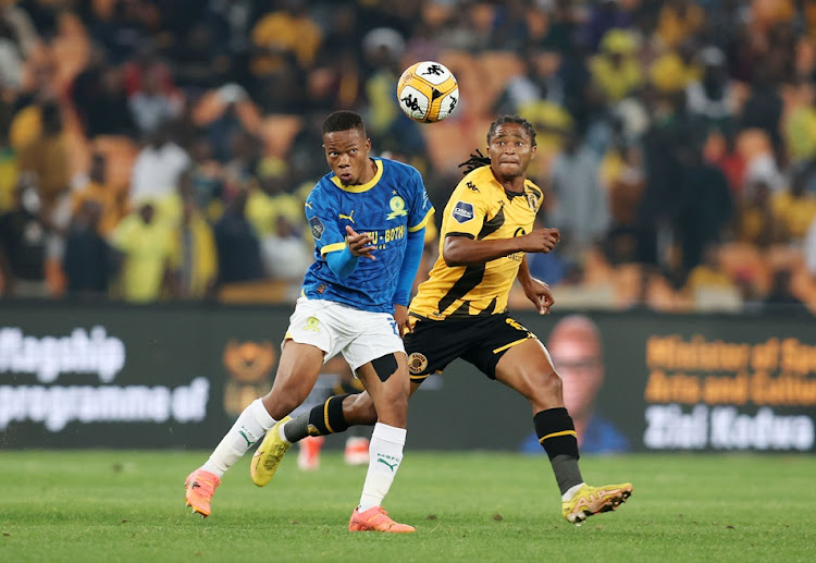 Mamelodi Sundowns midfielder Sphelele Mkhulise is challenged by Siyethemba Sithebe of Kaizer Chiefs during their DStv Premiership match at the FNB Stadium in Johannesburg.