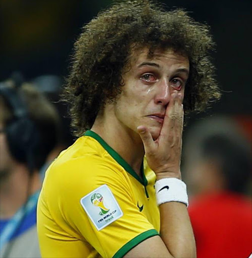 Brazil's David Luiz cries after his team lost to Germany in their 2014 World Cup semi-finals at the Mineirao stadium in Belo Horizonte. Photo credit: Reuters