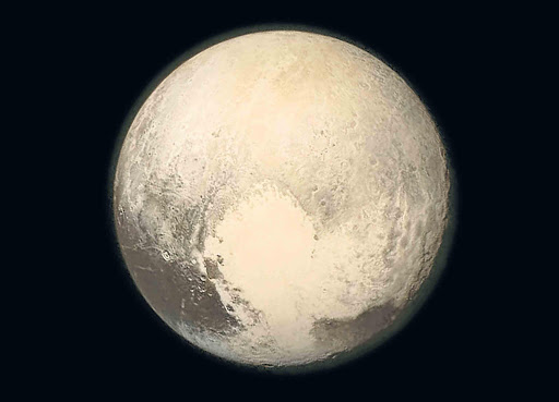 NEW DISCOVERIES: A handout picture made available by Nasa shows Pluto taken on Monday, when Nasa’s New Horizons spacecraft was 768 000km from the surface. This is the last image sent to Earth before the spacecraf t’s closest approach to Pluto yesterday when it flew past the planet at 14km per second Picture: EPA