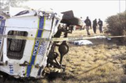 OVERTURNED: Three police officers died and two were seriously injured when their vehicle overturned yesterday morning. Pic. Lucky Nxumalo. 13/06/07. © Sowetan.