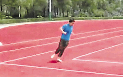 FAST LEFT: A runner tests the square-cornered track at a refurbished sports complex in Heilongjiang province, China