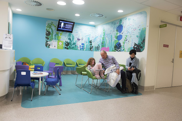 Charlie's parents, Rod and Maria, and sister Millie wait while he has an MRI.