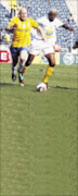 LONG AND SHORT: Sundowns' Matthews Pattison outruns Black Leopards' Samson Mofokeng during their Nedbank Cup clash at Orlando Stadium in Soweto yesterday. Pic : ANTONIO MUCHAVE. 02/05/2010. © Sowetan.

20100502AMU/SPORT/SOCCER.
Mamelodi Sundowns  Matthews  Pattison  fights for the ball with Black Leopard amson  Mofokeng during their Ned Bank cUP 
 Orlando Stdadium. PHOTO : ANTONIO MUCHAVE