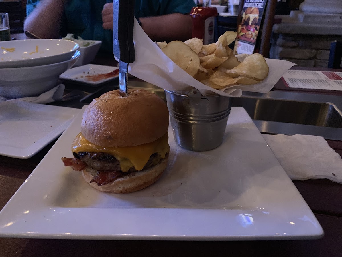 Does not do justice to the huge burger, big fluffy yummy gf bun. Juicy burger, perfectly cooked bacon and cheddar to top it off. Homemade chips were crispy and seasoned to compliment the great burger
