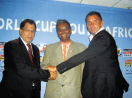 UNITED: National Lottery Distribution's Serhan Naidoo is sandwiched by Danny Jordaan, LOC's chief executive officer, and soccer legend Mark Fish at a media briefing yesterday. 06/04/09. Pic. Ramatsiyi Moholoa. © Sowetan.