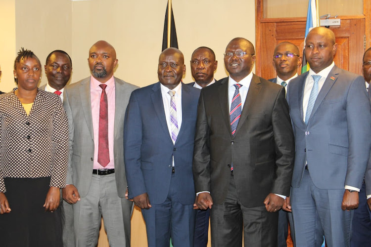 Cooperatives CS Simon Chelugui with the interim board of Kenya Union of Savings and Credit Cooperative (KUSCO) during their inauguration on May 7, 2024.