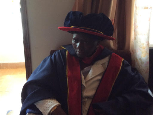 Dr Getrude Musuvure Inimah wearing her graduation gown