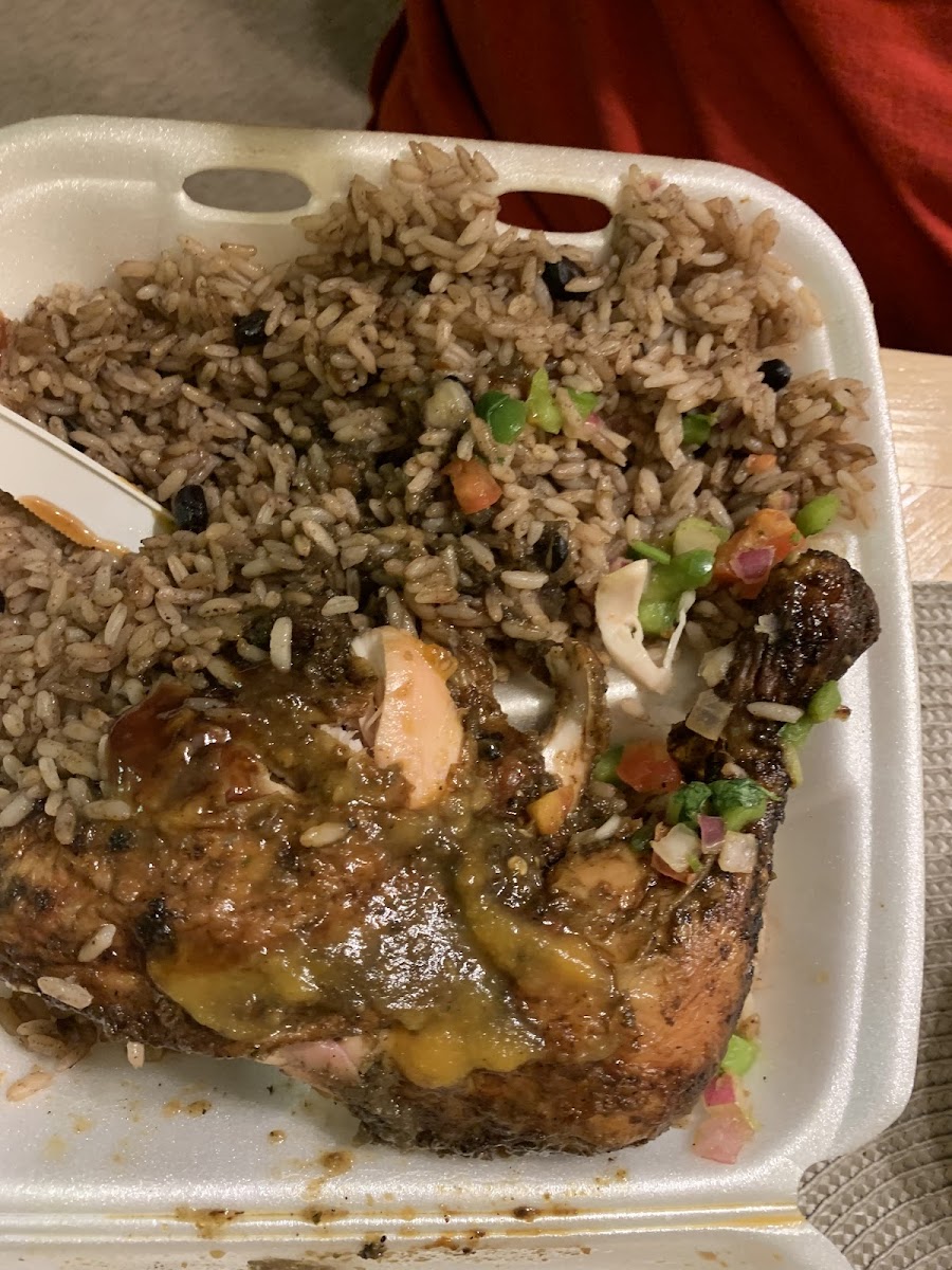 Jerk chicken leg with rice and beans