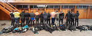 Some of the 24 alleged abalone poachers who were arrested at Robben Island on Tuesday.