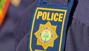 Close up of the SAPS badge on an officer's uniform.