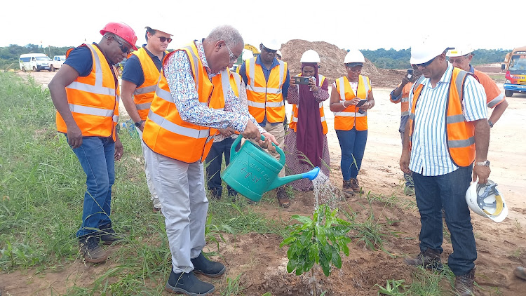 Governor Issa Timamy plants a tree at Base Titanium in Kwale County on Monday, October 23, 2023.
