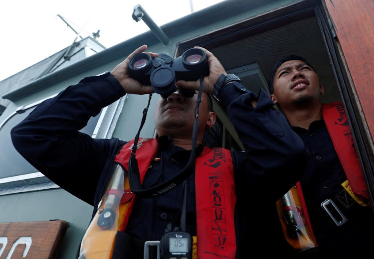 Indonesian customs officers patrol at a search area for Lion Air flight JT610 in Karawang waters, Indonesia, on November 1 2018.