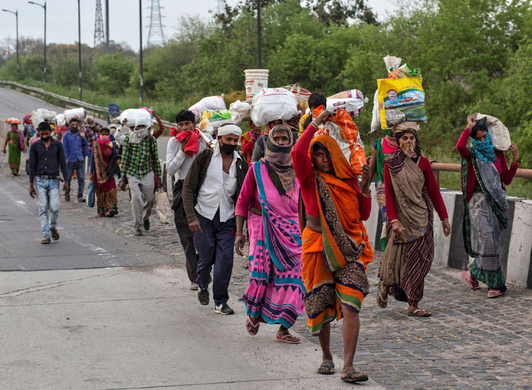 Migrant workers return to their villages during a 21-day nationwide lockdown in New Delhi, India, in this March 26 2020 file photo. Picture: REUTERS/DANISH SIDDIQUI