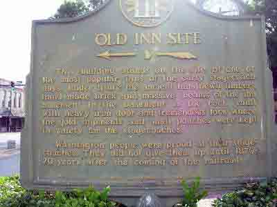 This building stands on the site of one of the most popular inns of the early stagecoach days. Under it are the ancient handhewn timbers, hand made brick and massive beams of the inn basement. In...